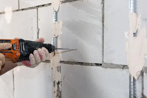 Builder man with pneumatic hammer drill perforator  Stock Photos