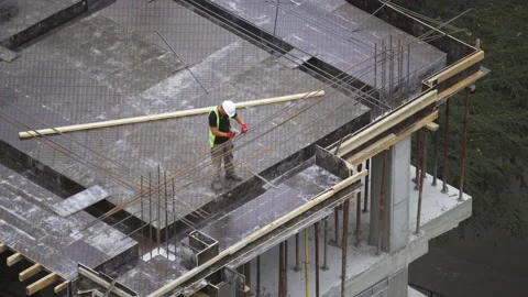 Builder marking on the rebar Stock Footage 168554628