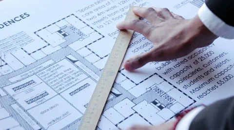 Builder measures the dimensions Stock Footage 42343767