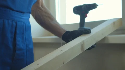 Builder measures the length of the board Stock Footage 124846947