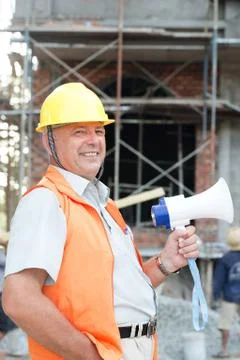Builder with a megaphone Stock Photos