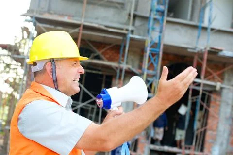 Builder with a megaphone Stock Photos