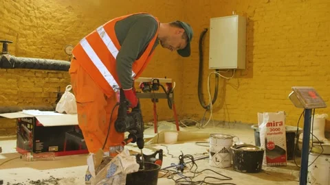 Builder mix concrete in bucket at construction site. Video stock 199837006