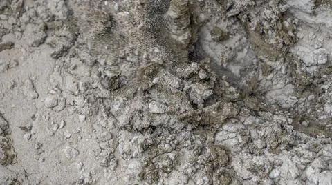 The builder mixes the construction mixture in a container for guiding the sol Stock Photos