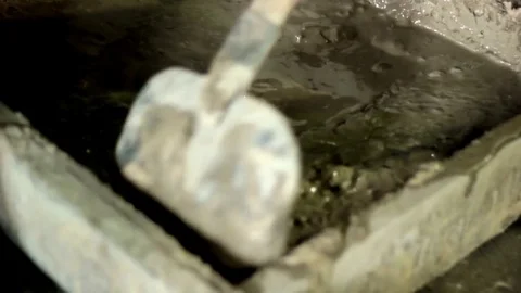 Builder mixing concrete for construction Stock Footage 71185173