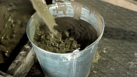 Builder mixing concrete for construction Stock Footage 71185193