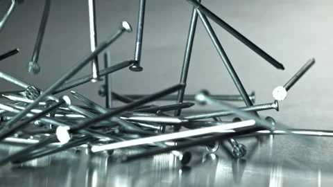 Builder nails scatter carpentry macro composition Filmed on a high-speed camera Stock Footage 335413374