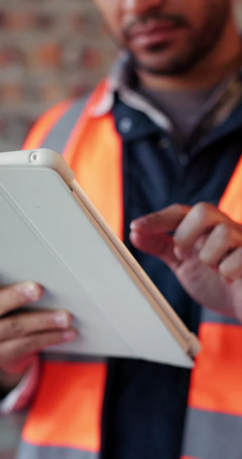 Builder, online and hands with tablet in building, search or safety inspection Video stock 336222511
