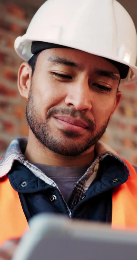Builder, online and happy man with tablet in building, search or safety Video stock 336222733
