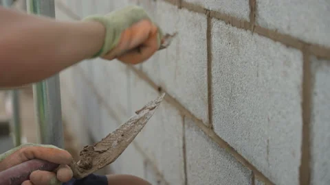 Builder Points Up Concrete Block Wall Stock Footage 239754636