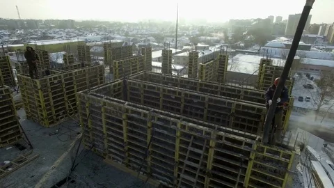 Builder pours cement from the hose in stone blocks Stock Footage 81942975