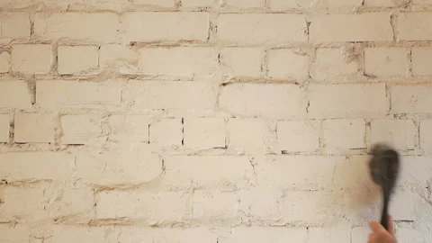 The builder prepares the wall before painting Stock Footage 89256111