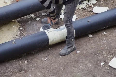 Builder preparing for pipe cutting Stock Photos