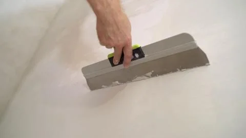 The builder put mortar on the wall. Plaster walls. Exterior finish. Putting m Stock Photos