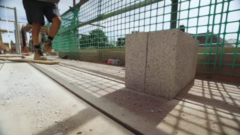 Builder Puts Concrete Block Down On Building Site Stock Footage 239755899