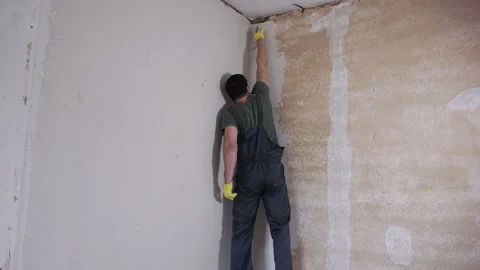 Builder puttying a wall, time lapse. Stock Footage 244671953