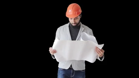 Builder reads drawings on paper Stock Footage 75668784