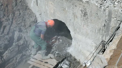 Builder repairing a manifold using steel disc saw Stock Footage 65451702