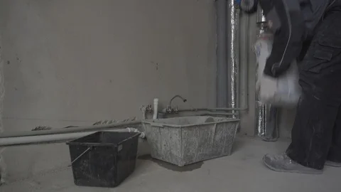 The builder in a respirator falls asleep in a container dry building material Stock Footage 101662425