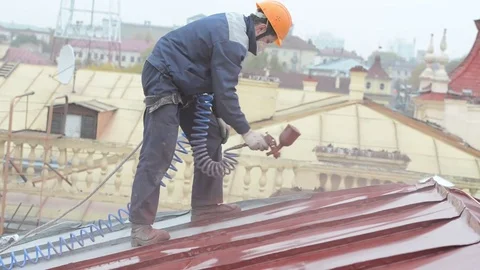 Builder roofer painter worker Stock Footage 84119261