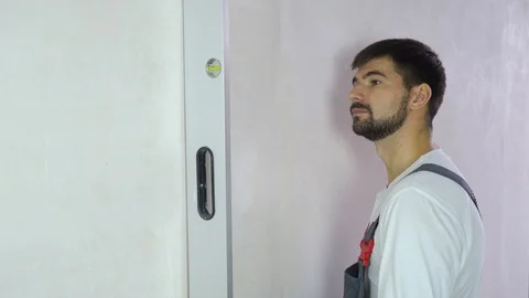 Builder is satisfied with quality of freshly built wall with free space Stock Footage 102887004