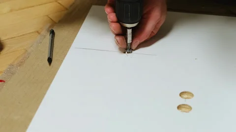 Builder screws screw into panel to stabilize overall structure Stock Footage 304402581