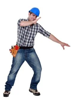 Builder shielding himself Stock Photos