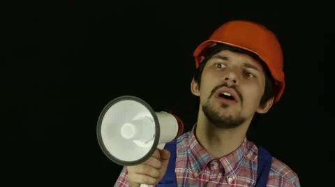 Builder shouting into a megaphone Stock Footage 21903132