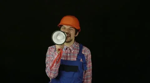 Builder shouting into a megaphone  Stock Footage 22418030