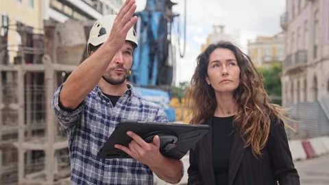 Builder show construction site project tablet Customer client discuss build plan Stock Footage 272761475