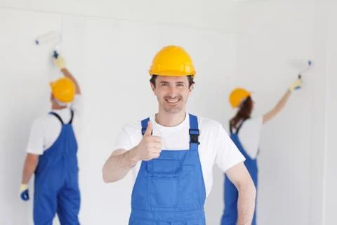 Builder in showing thumbs up Stock Photos