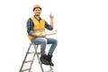 The builder sitting on the ladder and gesturing on the white background Photo