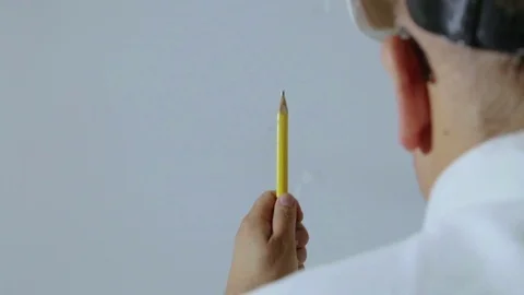 The builder with a sledgehammer and a pencil goes to the camera. Stock Footage 81355503