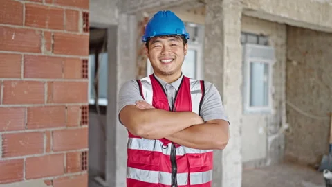 Builder smiling confident standing with arms crossed gesture at constructio.. 스톡 동영상 246149169