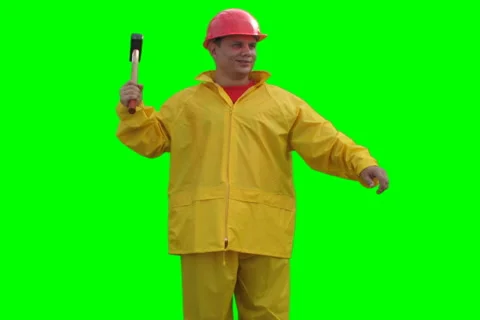 Builder spins with hammer on the Green Screen LOOP NTSC Stock Footage 1059422