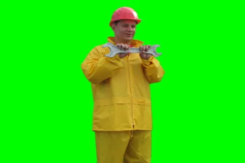 Builder spins with wrenches on the Green Screen LOOP NTSC Stock Footage 1059433