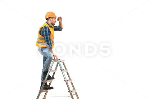 The builder standing on the ladder on the white background Stock Photos