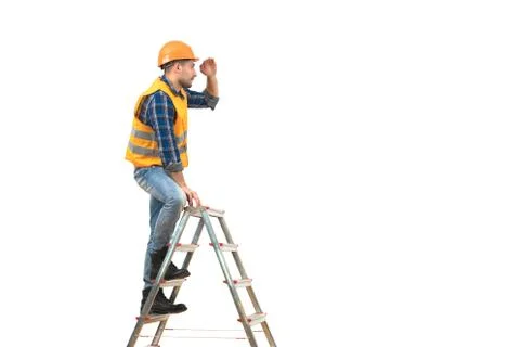 The builder standing on the ladder on the white background Stock Photos