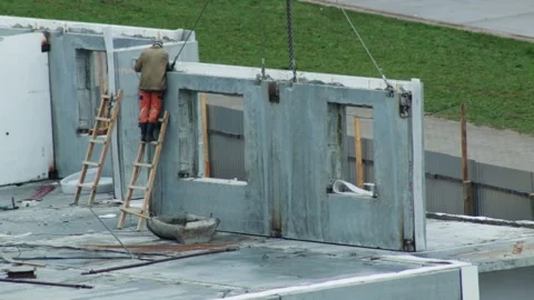 Builder Stands On Ladder While Grinding Concrete Panel. Industrial Worker Stock Footage 322095092