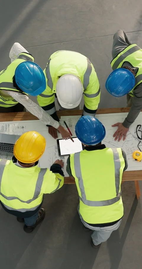 Builder, team and research with tablet screen in building, above and plan for Stock Footage 347376273