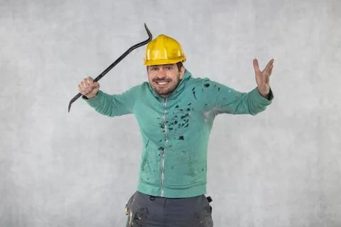 The builder tests the strength of the protective helmet Stock Photos