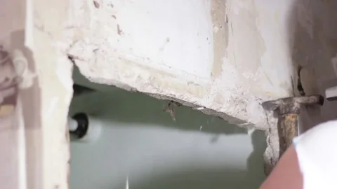 Builder two hammers break the concrete wall Stock Footage 74794510