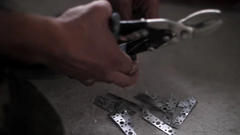Builder uses metal scissors. Renovation in the apartment. Stock Footage 247507962