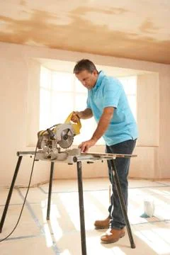 Builder Using Electric Saw Stock Photos