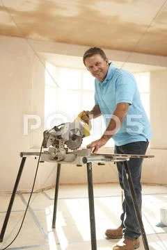 Builder Using Electric Saw Stock Photos