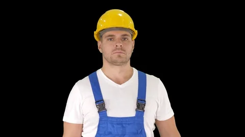 Builder walking and looking to camera, Alpha Channel Stock Footage 115996143