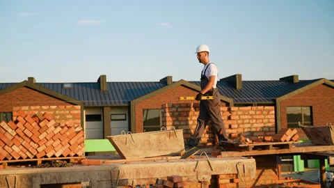 Builder Walking on a Cottage Construction Site Video stock 293640263