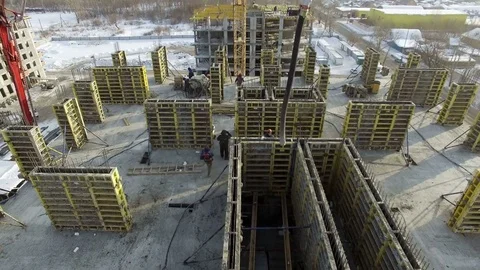 Builder up onto the wall and goes to the hose Stock Footage 82021454