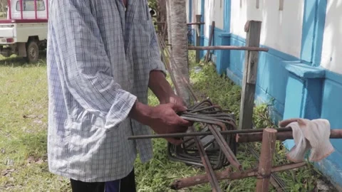 A builder who is assembling building iron Stock Footage 207481857