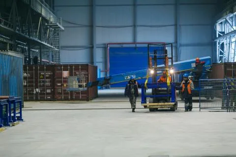 A builder in a work robe is engaged in the installation and construction Stock Photos